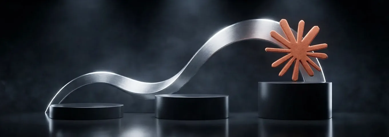 The Claude logo on the tallest of three black plinths, with a brushed steel ribbon rising behind it
