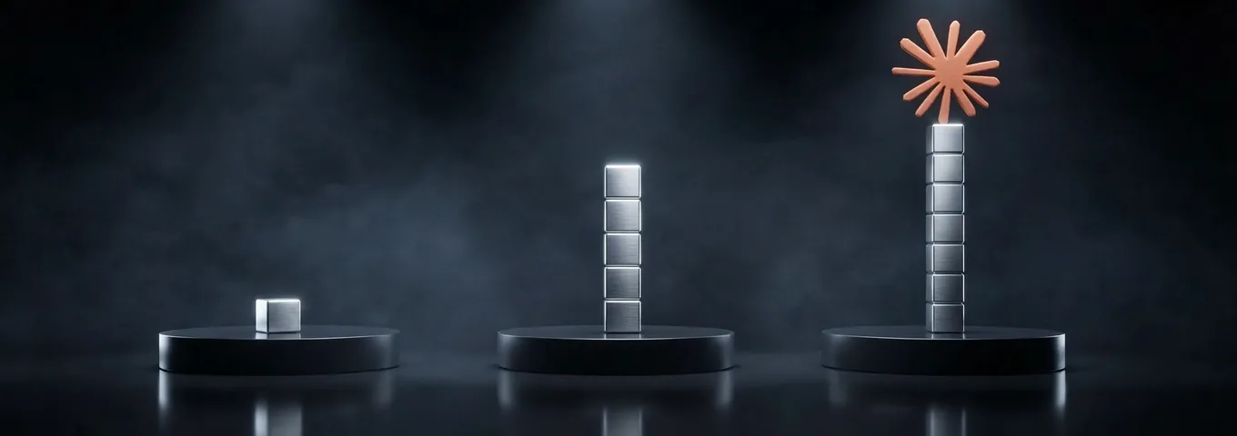 Three black plinths in a dark charcoal studio: one chrome cube on the first, a stack of five chrome cubes on the second, and a taller column of chrome cubes on the third, topped by a terracotta Claude starburst.